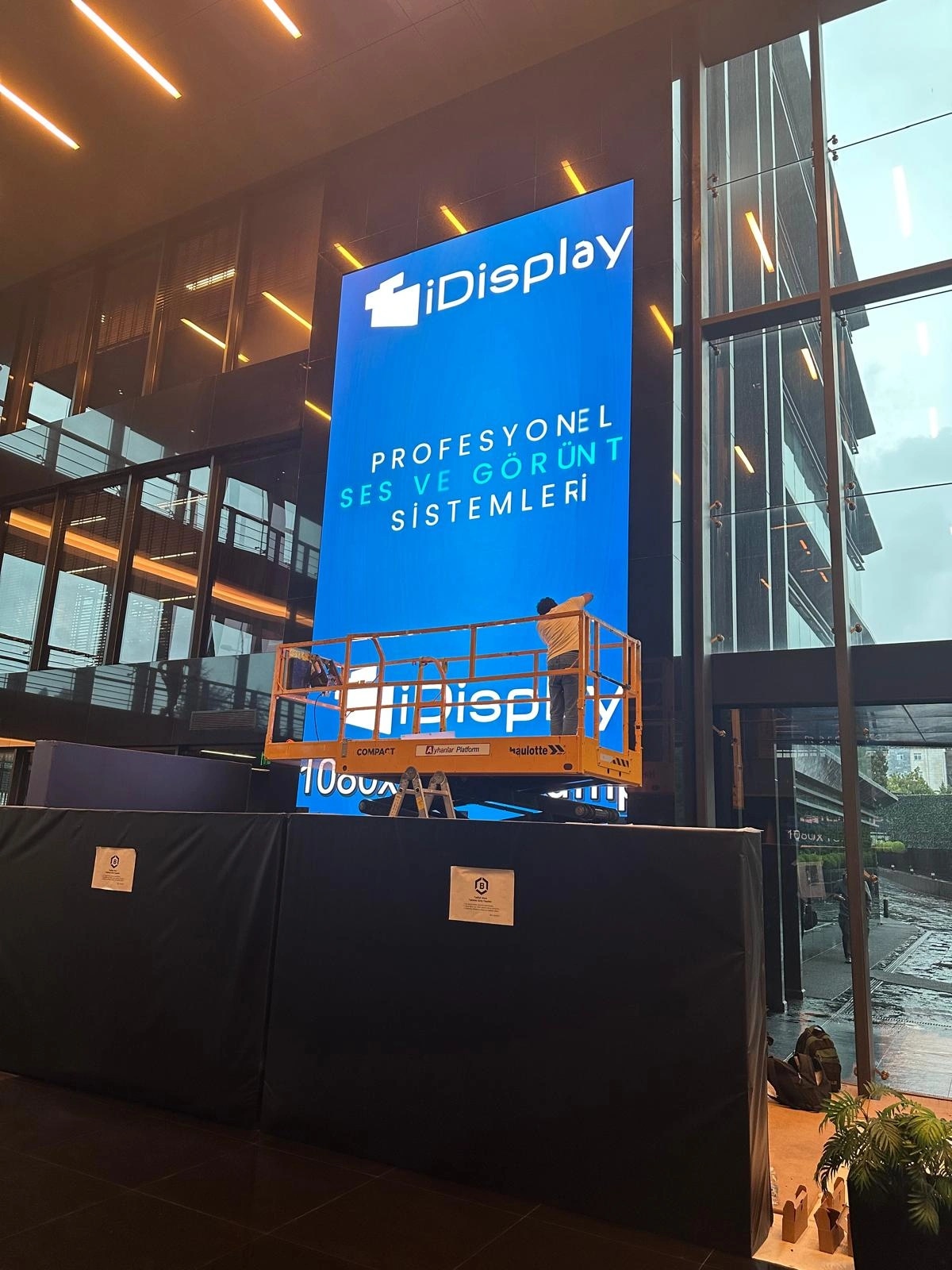 Vertical LED totem in a plaza lobby